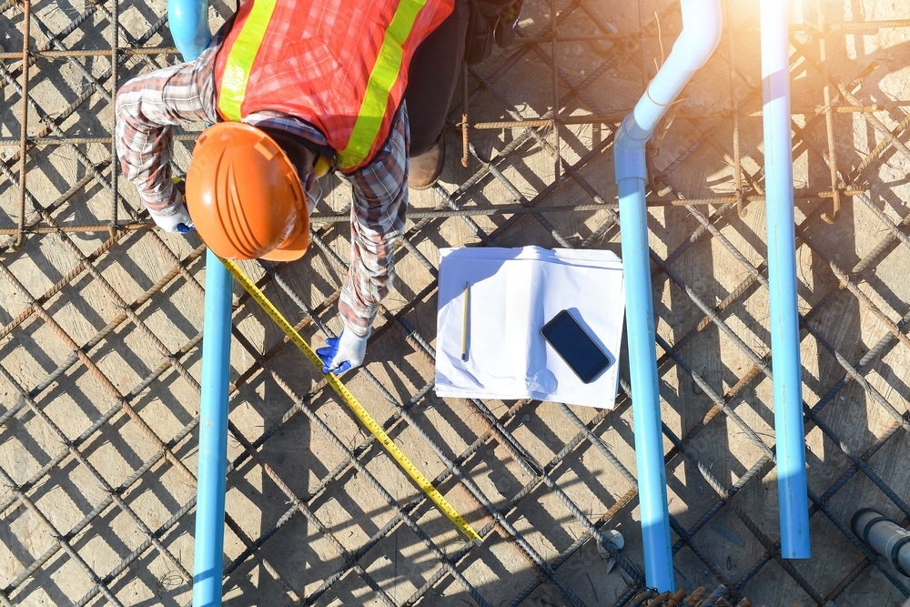 making measurements for steel building foundation